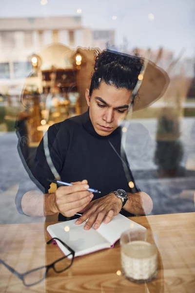 Young Male Writer Black Curly Hair Sitting Indoors Cafe Pen — Stok fotoğraf