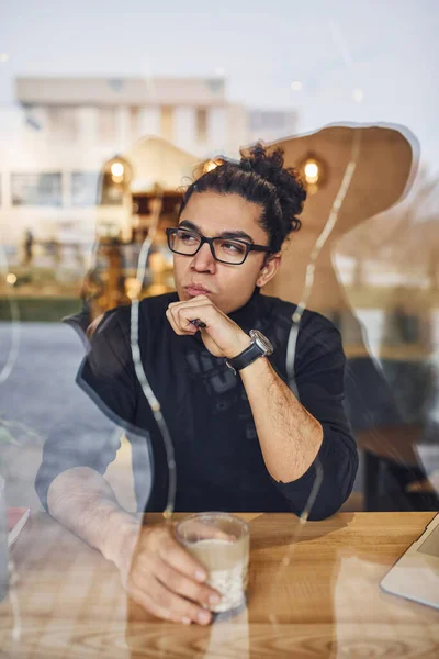 Young Guy Black Curly Hair Sitting Indoors Cafe View Glass — Stok fotoğraf