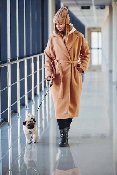 Woman Warm Clothes Walking Her Little Pug Dog Indoors Hall — Foto Stock