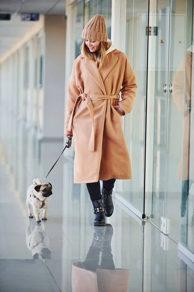 Woman Warm Clothes Walking Her Little Pug Dog Indoors Hall — Foto Stock