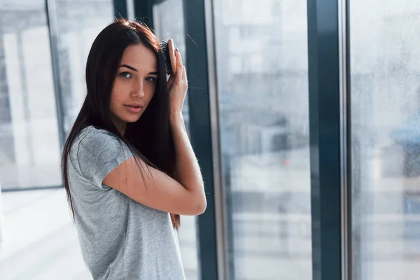 Beautiful Young Brunette Grey Shirt Standing Window Posing Camera — Stockfoto