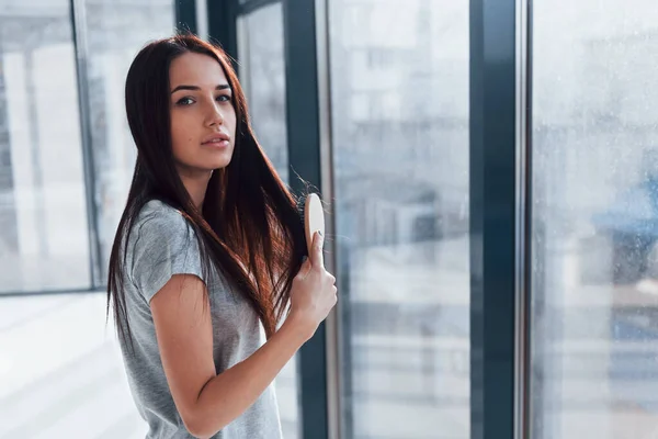 Beautiful Young Brunette Grey Shirt Standing Window Posing Camera — Stockfoto
