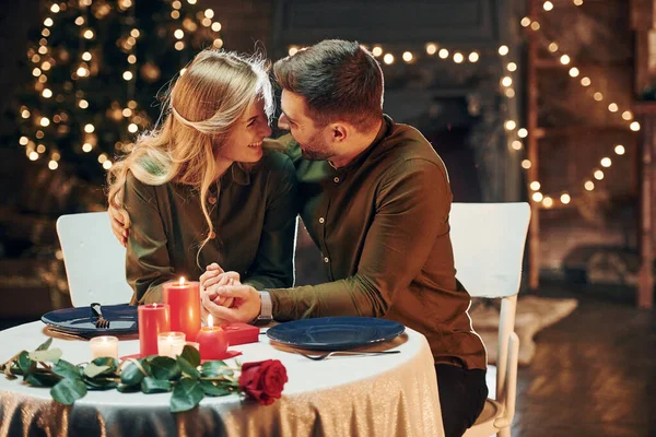 Closeness of the people. Young lovely couple have romantic dinner indoors together.