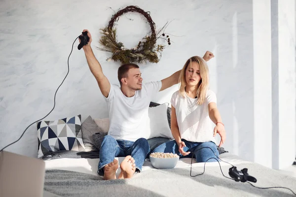 Young Lovely Couple Together Home Playing Video Games Bed Popcorn — Stock Fotó