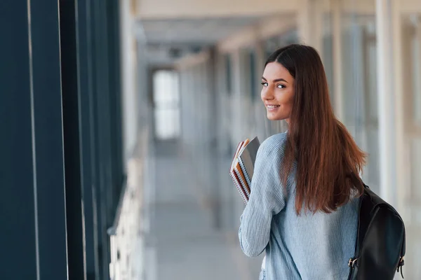 Rear View Female Young Student Corridor College Holding Notepads — 스톡 사진