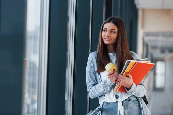 Female Young Student Corridor College Holding Notepads Apple — Fotografia de Stock