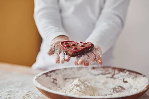 Close View Little Girl Hands Holding Sweet Cookie Kitchen Plate — стоковое фото