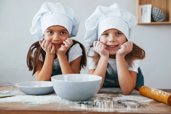Two Little Girls Blue Chef Uniform Smiling Together Kitchen — Stockfoto