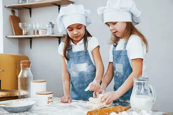 Two Little Girls Blue Chef Uniform Kneading Dough Kitchen — Zdjęcie stockowe