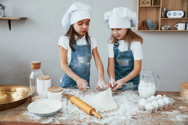 Two Little Girls Blue Chef Uniform Kneading Dough Kitchen — Stockfoto