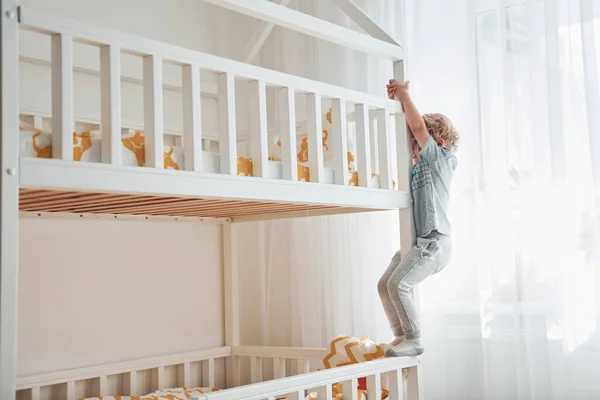 Cute Little Boy Resting Have Fun Indoors Room Bed — Stockfoto