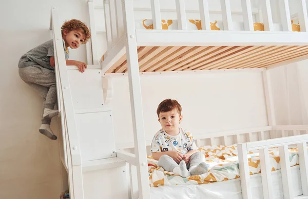 Two Little Boys Resting Have Fun Indoors Bedroom Together — Stock Photo, Image