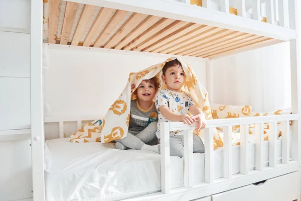 Two Little Boys Resting Have Fun Indoors Bedroom Together — Stock Photo, Image