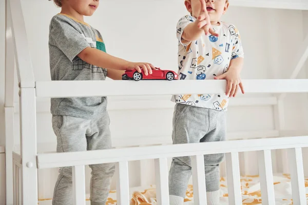 Two Little Boys Resting Have Fun Indoors Bedroom Together — Stok fotoğraf