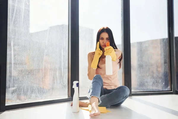 Portrait Woman Sits Window Sill Bottles Cleaning Spray Hands — Stock Photo, Image