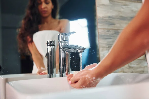 Beautiful Brunette Standing Bathroom Mirror Washing Hands — Fotografia de Stock