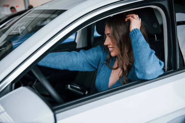 Positive Woman Blue Shirt Sits New Brand New Car Auto — Foto de Stock