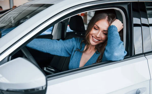 Positive Woman Blue Shirt Sits New Brand New Car Auto — Foto de Stock