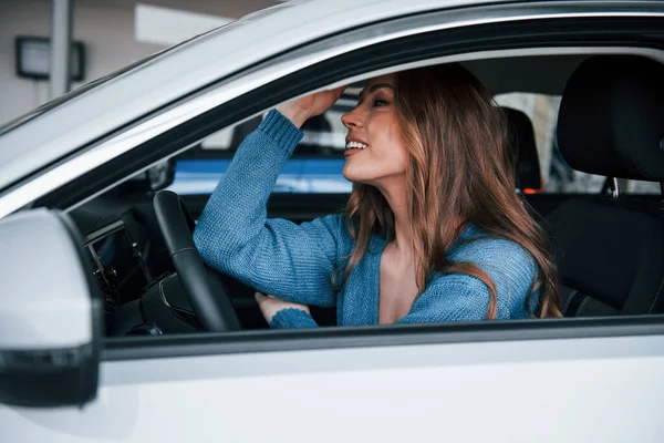 Positive Woman Blue Shirt Sits New Brand New Car Auto — Foto de Stock