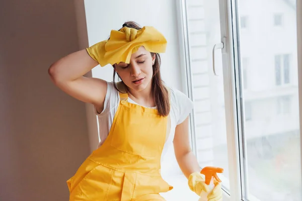Tired Housewife Yellow Uniform Takes Break Indoors House Renovation Conception — Zdjęcie stockowe