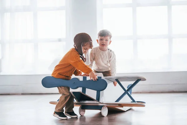 Two Little Boys Retro Pilot Uniform Having Fun Toy Plane — Stockfoto