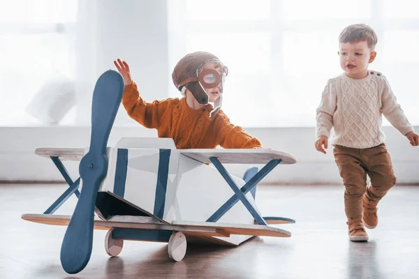 Two Little Boys Retro Pilot Uniform Having Fun Toy Plane — Stock fotografie
