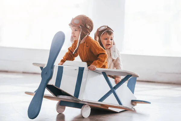 Two Little Boys Retro Pilot Uniform Having Fun Toy Plane — Stok fotoğraf