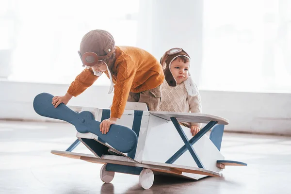 Two Little Boys Retro Pilot Uniform Having Fun Toy Plane — Stok fotoğraf