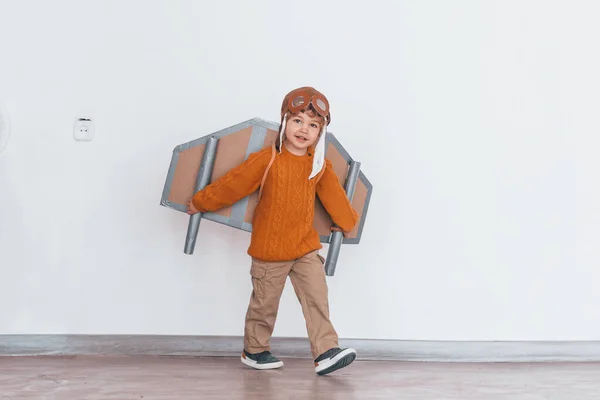 Little Boy Retro Pilot Uniform Running Toy Plane Indoors — Zdjęcie stockowe
