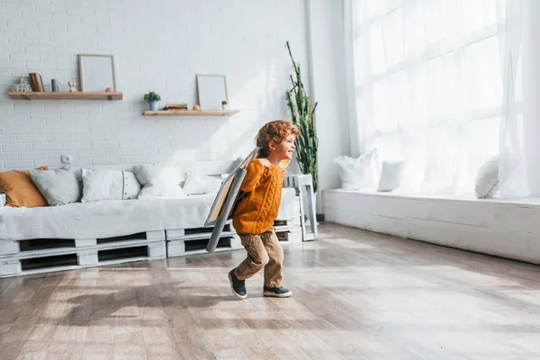 Little Boy Retro Pilot Uniform Running Toy Plane Indoors — Stok fotoğraf