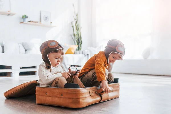 Two Little Boys Have Fun Sitting Suitcase Indoors Daytime — Foto Stock