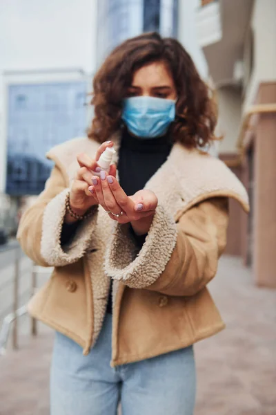 Portrait Young Girl Curly Hair Protective Mask Using Antiseptic Outdoors — Foto de Stock