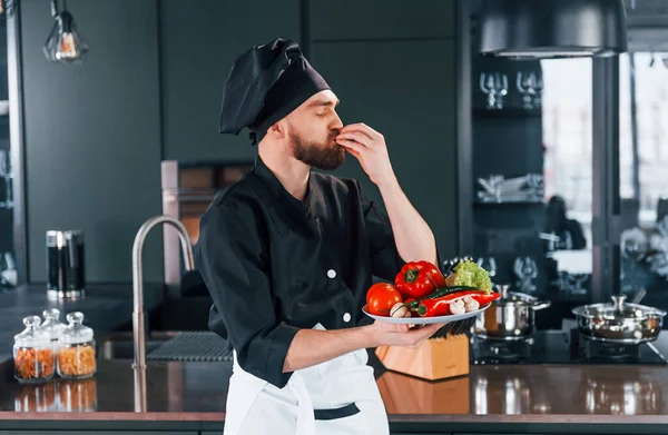 Professional Young Chef Cook Uniform Holds Plate Vegetables Kitchen — Foto de Stock