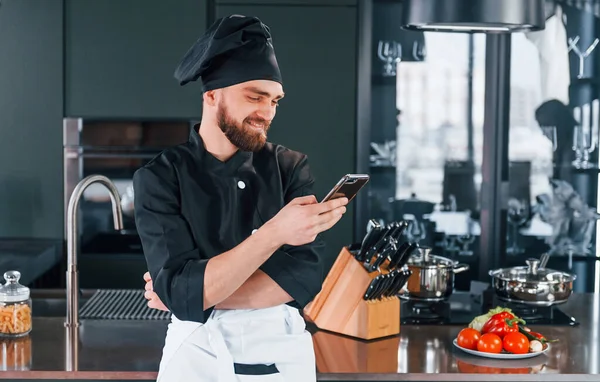 Professional Young Chef Cook Uniform Standing Phone Kitchen — Fotografia de Stock