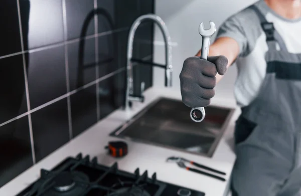 Close View Young Professional Plumber Grey Uniform Holding Wrench Hand — Zdjęcie stockowe