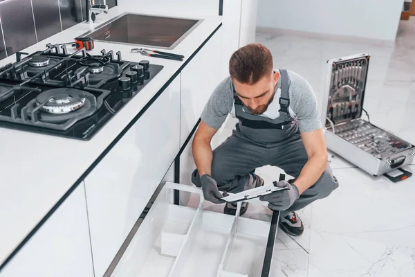 Young Professional Plumber Grey Uniform Working Kitchen — Zdjęcie stockowe