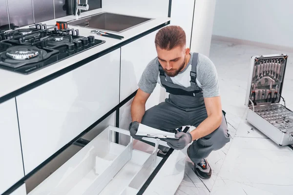 Young Professional Plumber Grey Uniform Working Kitchen — Zdjęcie stockowe