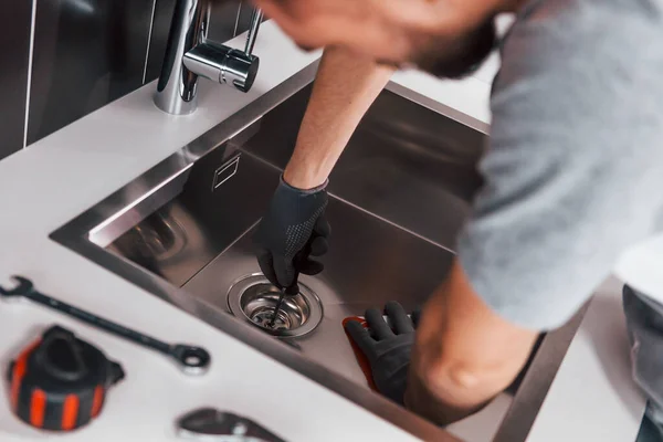 Young Professional Plumber Grey Uniform Working Kitchen — Zdjęcie stockowe