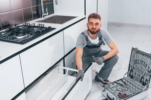 Young Professional Plumber Grey Uniform Using Equipment Kitchen Preparing Work — Zdjęcie stockowe