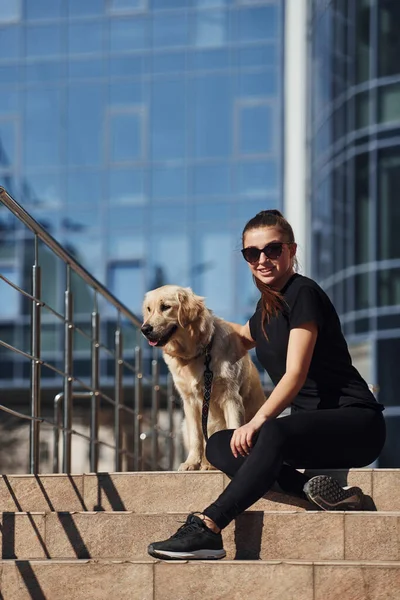 Young Positive Woman Sitting Stairs Her Dog Have Walk Outdoors — Stockfoto