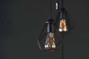 Modern designed light bulbs hangs on the wall indoors. Decoration and domestic life.