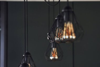 Modern designed light bulbs hangs on the wall indoors. Decoration and domestic life.