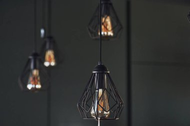 Modern designed light bulbs hangs on the wall indoors. Decoration and domestic life.