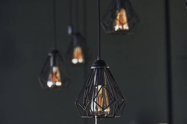 Modern designed light bulbs hangs on the wall indoors. Decoration and domestic life.