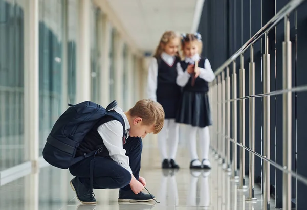 Boy Sitting Floor School Kids Uniform Together Corridor — Foto Stock