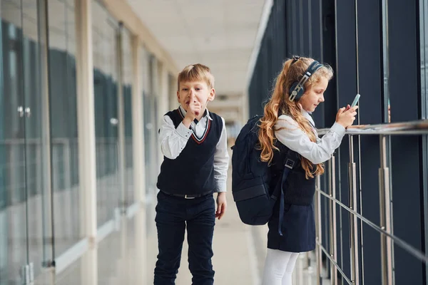 Little Schoolboy Steals Things Girl Bag While She Listening Music — Fotografia de Stock