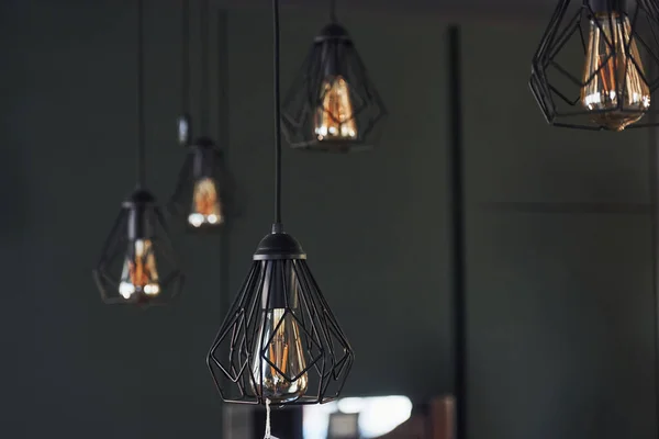 Modern designed light bulbs hangs on the wall indoors. Decoration and domestic life.