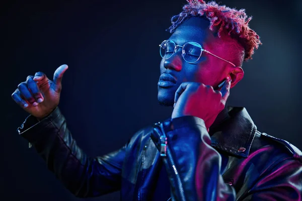 Listening Music Futuristic Neon Lighting Young African American Man Studio — стокове фото