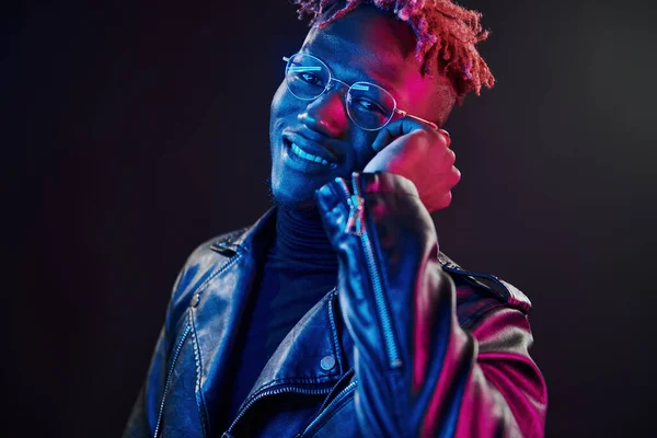 Listening Music Futuristic Neon Lighting Young African American Man Studio — стоковое фото