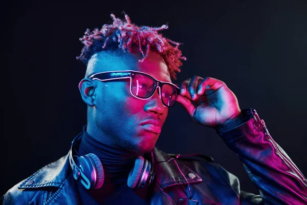 Stylish Glasses Wireless Headphones Futuristic Neon Lighting Young African American — Stock Fotó